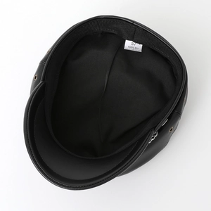 Classic black PU leather newsboy cap showing internal lining and size 57 label details
