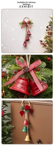 Detail of vintage Christmas bells with pine cones and berries on rustic hemp rope decor