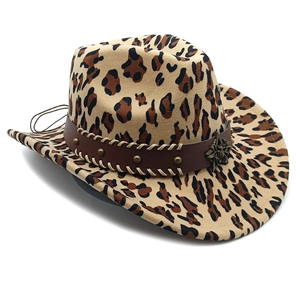 Detail of leopard print cowboy hat with studded leather band and star metal badge