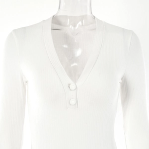 Close-up of white long-sleeved V-neck bodysuit featuring ribbed texture and button detail