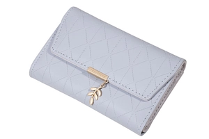 Close-up of light blue PU leather wallet featuring diamond lattice and gold leaf charm