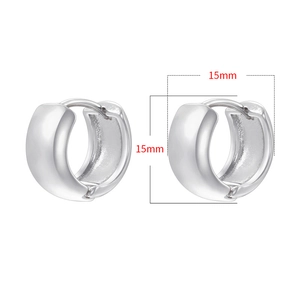 Detailed close-up of 15mm chunky silver hoop earrings with a polished metal finish