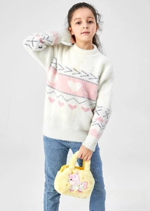 Close-up of fluffy yellow plush bag featuring pink unicorn embroidery and stars