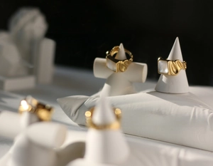 Detail of vintage 18K gold plated wide rings with shell inlay and textured band