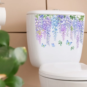 Close-up of floral wall stickers with purple wisteria and butterflies on a toilet tank