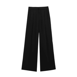 Detail view of black wide-leg suit trousers with pleats on a clean white background