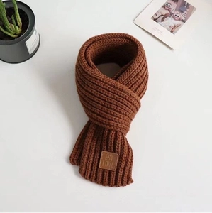 Cozy caramel brown knitted scarf for kids featuring an aesthetic EST LOVE leather patch