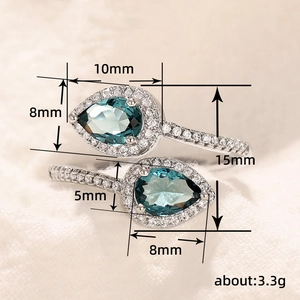 Elegant teardrop blue stone ring with small white zircon accents and adjustable open band