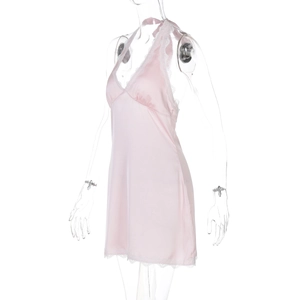 Detailed view of pink silk satin slip dress with delicate white lace trim on the V-neckline
