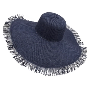 Detail of navy blue wide brim straw sun hat with stylish frayed fringe edges for women