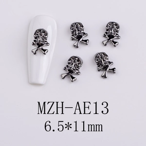 Detailed gunmetal skull nail charm sized 6.5x11mm for dark aesthetic gothic manicure