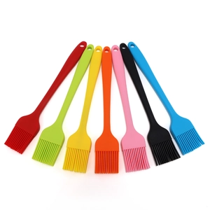 Set of 7 colorful silicone basting brushes for baking and BBQ, neatly arranged in a fan shape