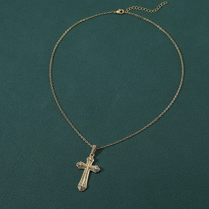 Fashion gold plated copper cross pendant necklace with white zircon on green background