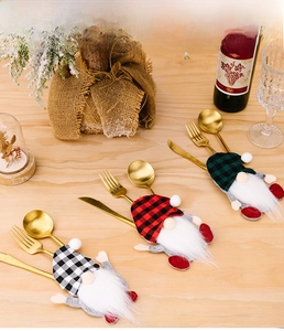 Three-piece gnome cutlery holders with buffalo plaid hats for Christmas table settings
