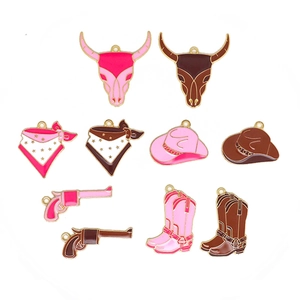Western cowboy style enamel charms set with hats, boots and skulls in pink and brown