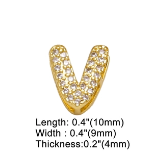 Macro shot of gold V letter pendant with clear zircon inlay and size dimensions