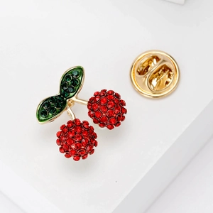 Cute cherry brooch pin with red and green rhinestones on elegant gold metal base
