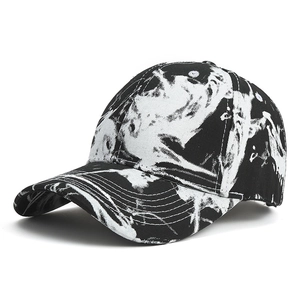 Street style baseball cap with black and white abstract camo print and distressed denim design