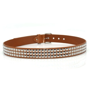 Detailed view of brown leather punk belt with three rows of silver pyramid studs