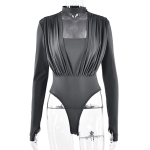 Detailed view of the deep V-neck and ruched texture on this dark gray long sleeve bodysuit