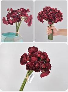 Close-up of vintage burgundy faux ranunculus bouquet tied with rustic jute rope