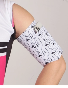 Close-up of flexible sports armband in white with black patterns holding a smartphone