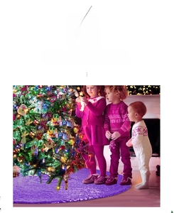 Detail of purple sequin Christmas tree skirt featuring a seamless hook and loop closure