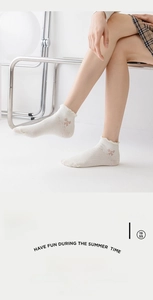 Detailed view of summer breathable mesh ankle socks with ruffle trim and pink bow accent