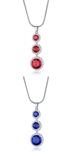 Detail of silver necklaces with red and blue teardrop zircon pendants in a row
