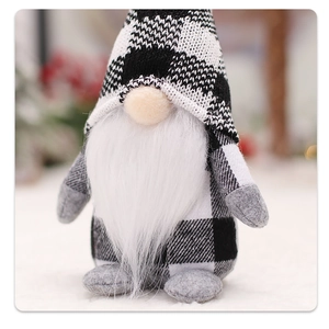 Close-up of a Christmas gnome with black and white plaid hat and long white beard
