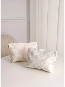 Floral canvas makeup bag set in pink and blue flower patterns for travel storage