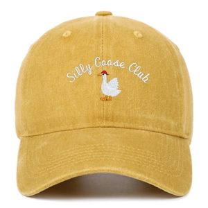 Detail of Silly Goose Club embroidery on a vintage mustard yellow washed cotton baseball cap