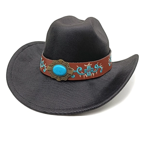Detail of black western cowboy hat with leather band and turquoise gemstone accent