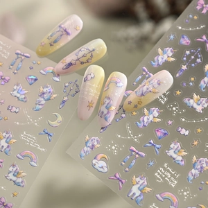 Unicorn and rainbow nail stickers with pastel gradients and motivational English quotes