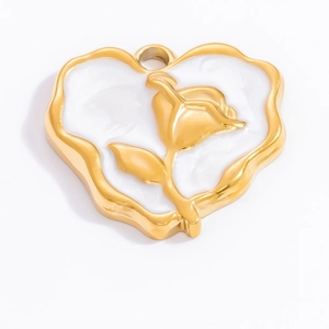 Detailed macro view of heart-shaped 18k gold pendant with white enamel and rose relief