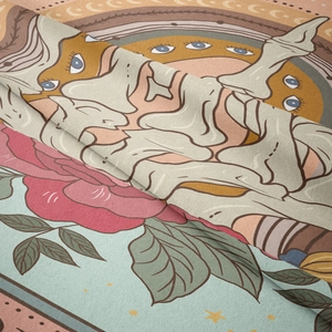Macro shot of bohemian tapestry fabric showing skull hand and rose pattern textures