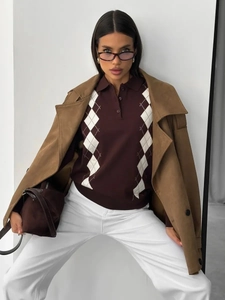 Detail of dark brown waffle knit Polo shirt with textured check pattern and refined collar