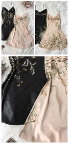 Detail of floral satin nightdress featuring cowl neck and delicate silk texture