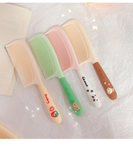 Detail of four colorful cartoon hair combs with cute 3D embossed fruit and animal patterns