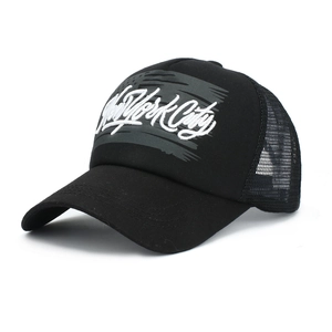 Detail view of the black trucker hat featuring white New York City embroidery and mesh back