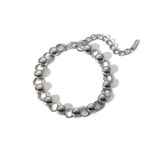 Close-up of silver beaded titanium steel bracelet with extension chain and S.STEEL tag