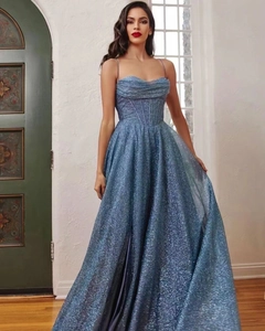 Detail of blue sequined maxi dress showing sparkling fabric and high slit design