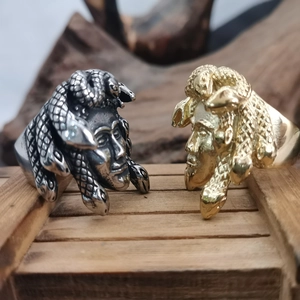 Retro punk Medusa head rings in gold and silver finish, detailed stainless steel relief