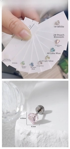 Macro detail of 5.5mm heart crystal stud earrings showing sizes and ten color options