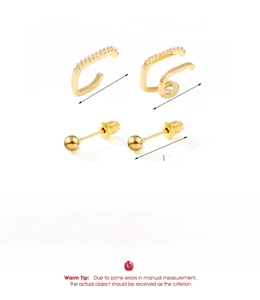 Detail showing gold plated C-shaped ear cuffs with small zircons and ball studs