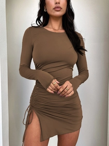 Close-up of side drawstring ruching and high slit detail on a brown slim fit dress