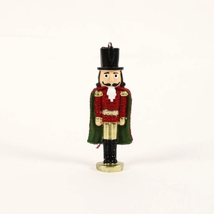 Standing resin nutcracker soldier ornament with red glitter jacket and green cape