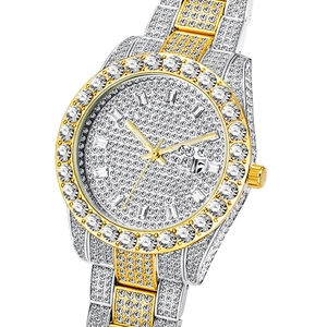 Macro detail of luxury iced-out watch with crystal-encrusted dial and gold-tone hands