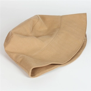 Detailed view of khaki sun hat featuring high-quality herringbone weave texture and wide brim