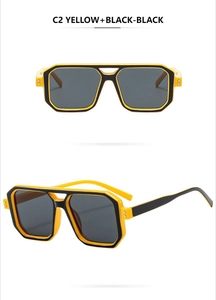 Detail of yellow and black pilot sunglasses with double bridge and square frame